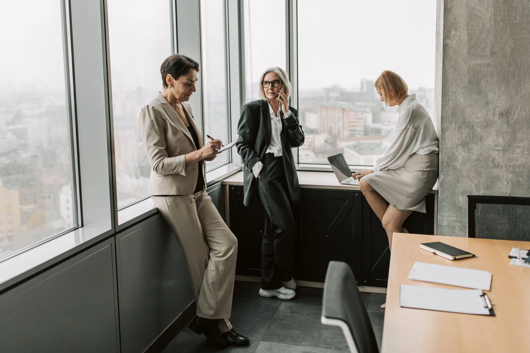 The Prodezk team collaborating in a bright, modern high-rise office