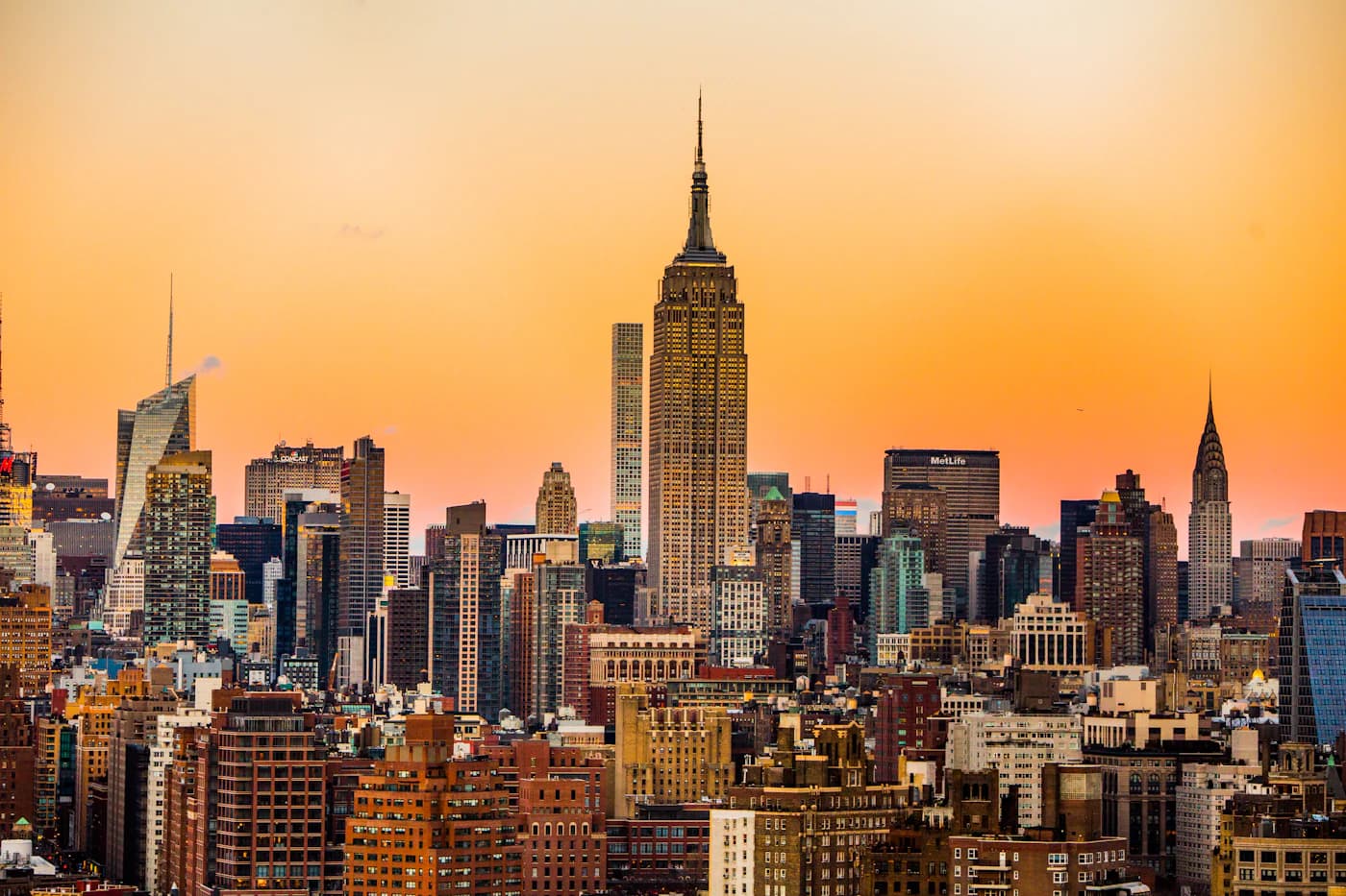 Manhattan skyline at golden hour, viewed from across the East River.