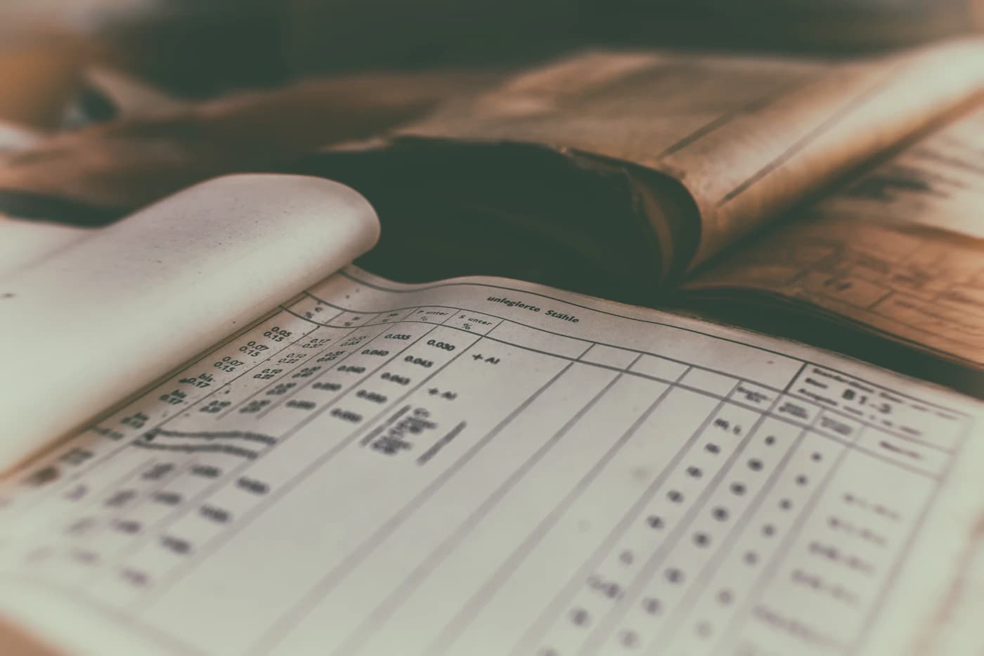 Handwritten ledger pages in warm light.