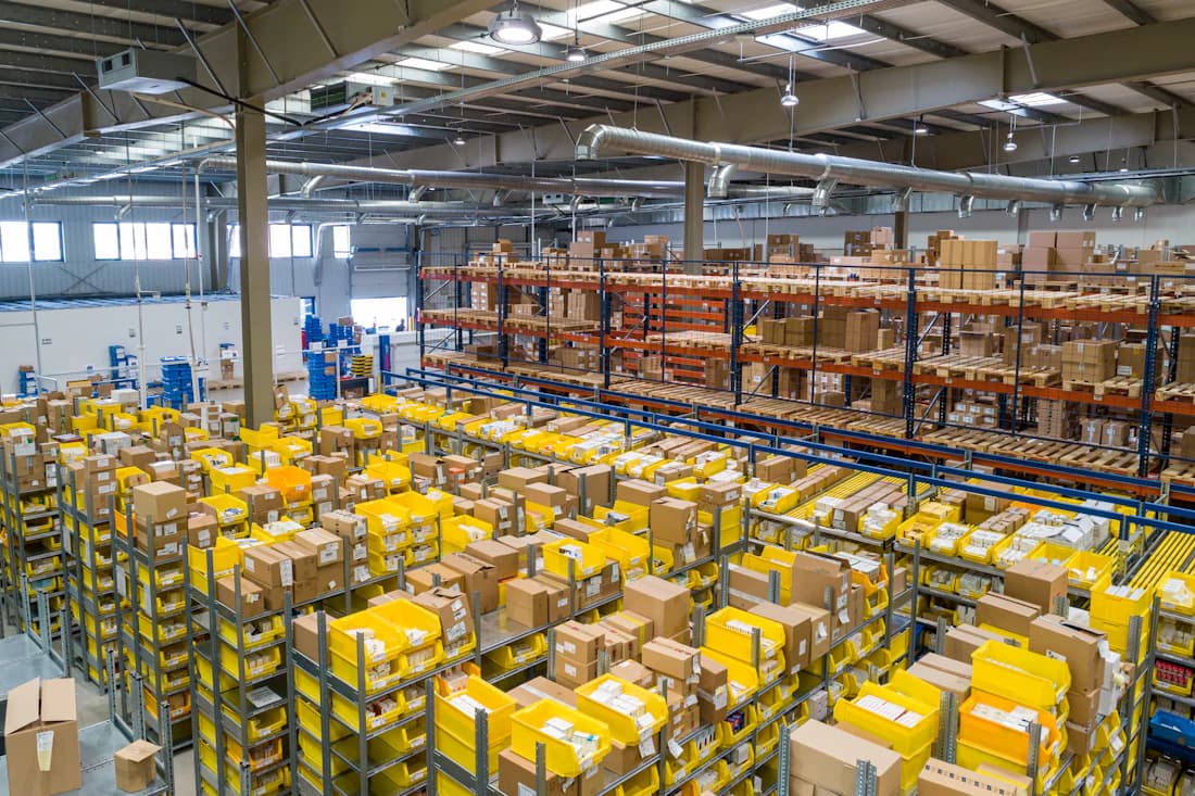 A vast fulfillment warehouse stocked with inventory.