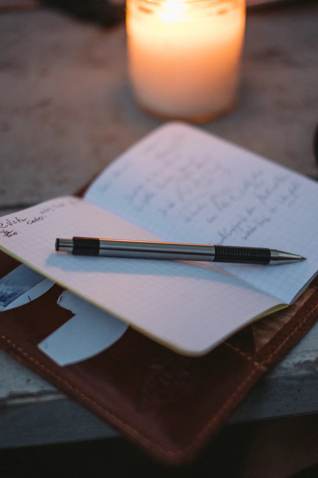 A leather folio and pen by candlelight, each credential delivered with care.