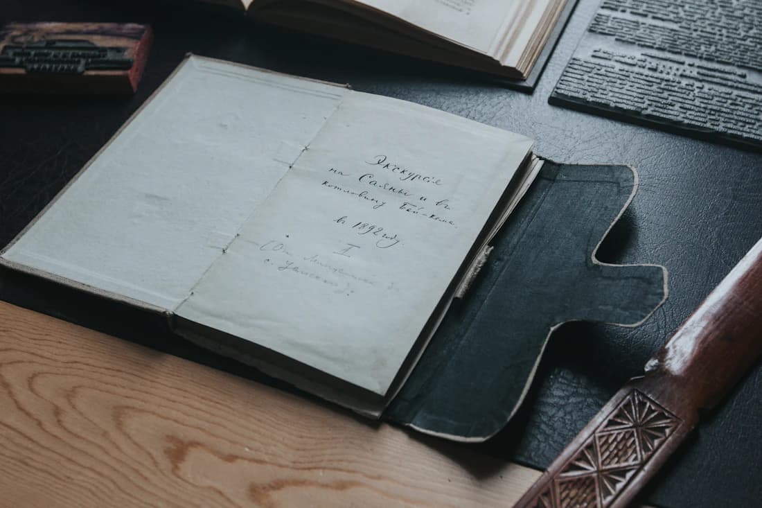 An open record book resting in its leather case.