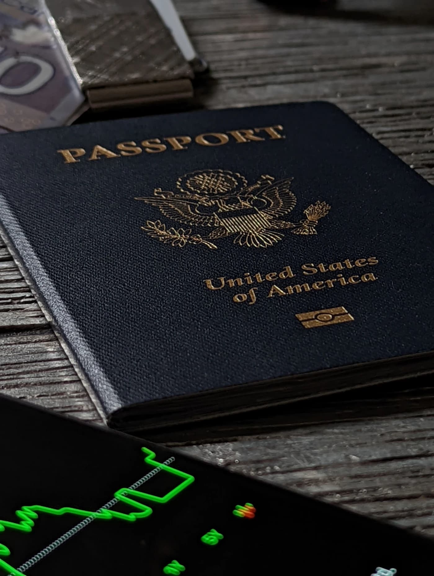 A passport and corporate documents laid out on a banker's desk for review.