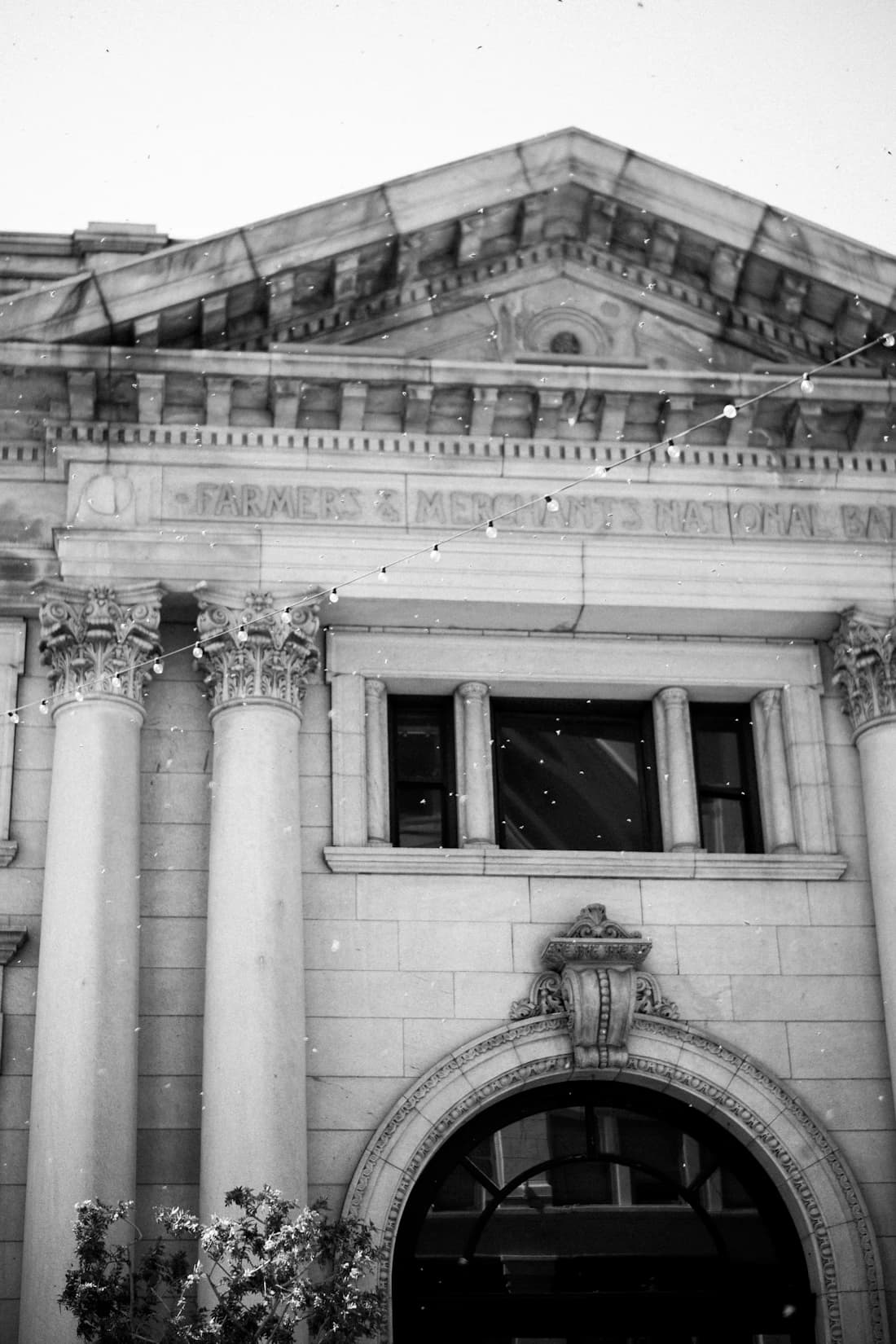 The columned facade of a historic national bank.