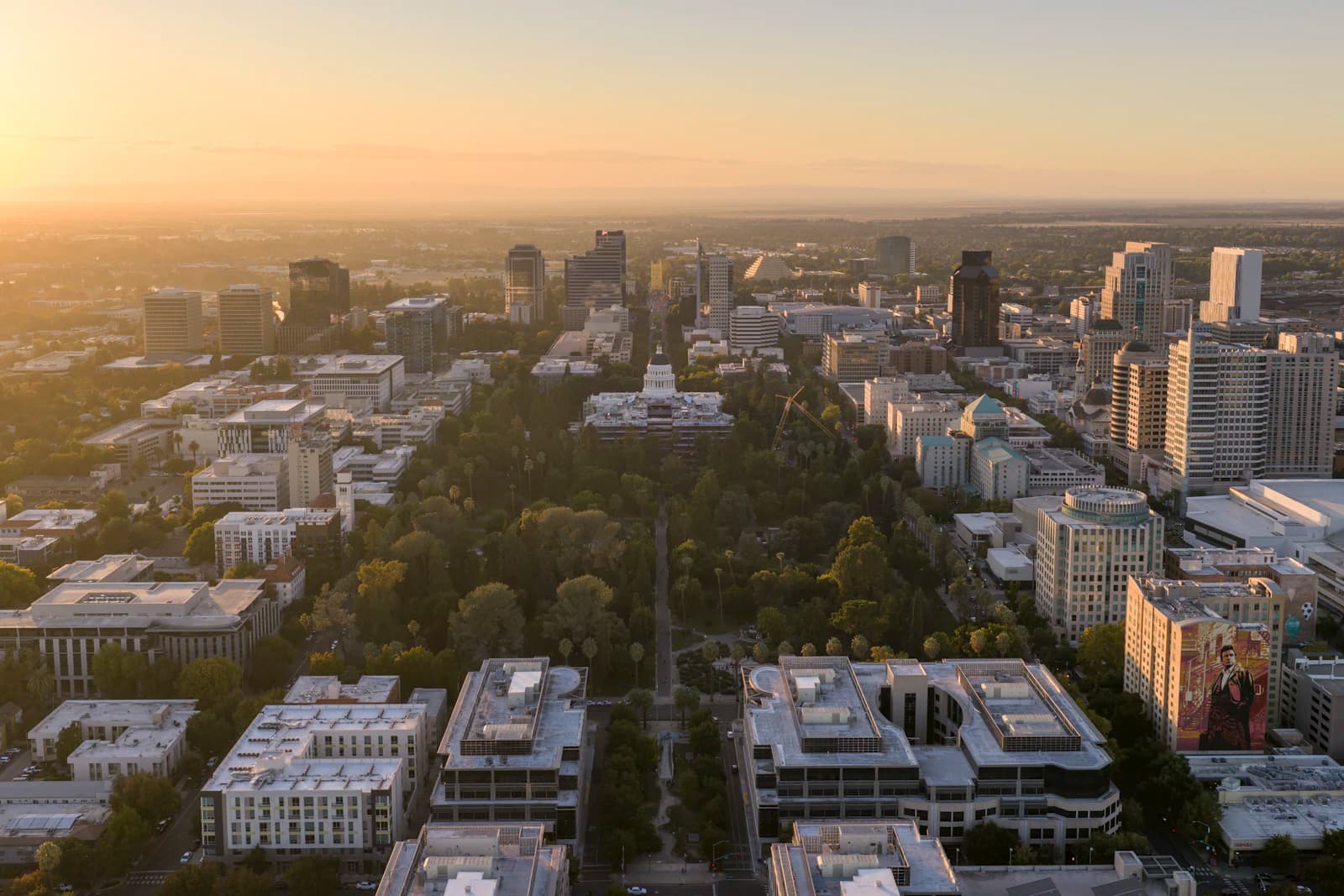 An aerial view of a US city at golden hour, brands building across all fifty states.