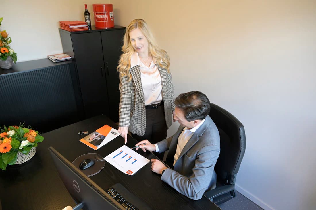 Two specialists reviewing the books together, the US-licensed team behind your plan.